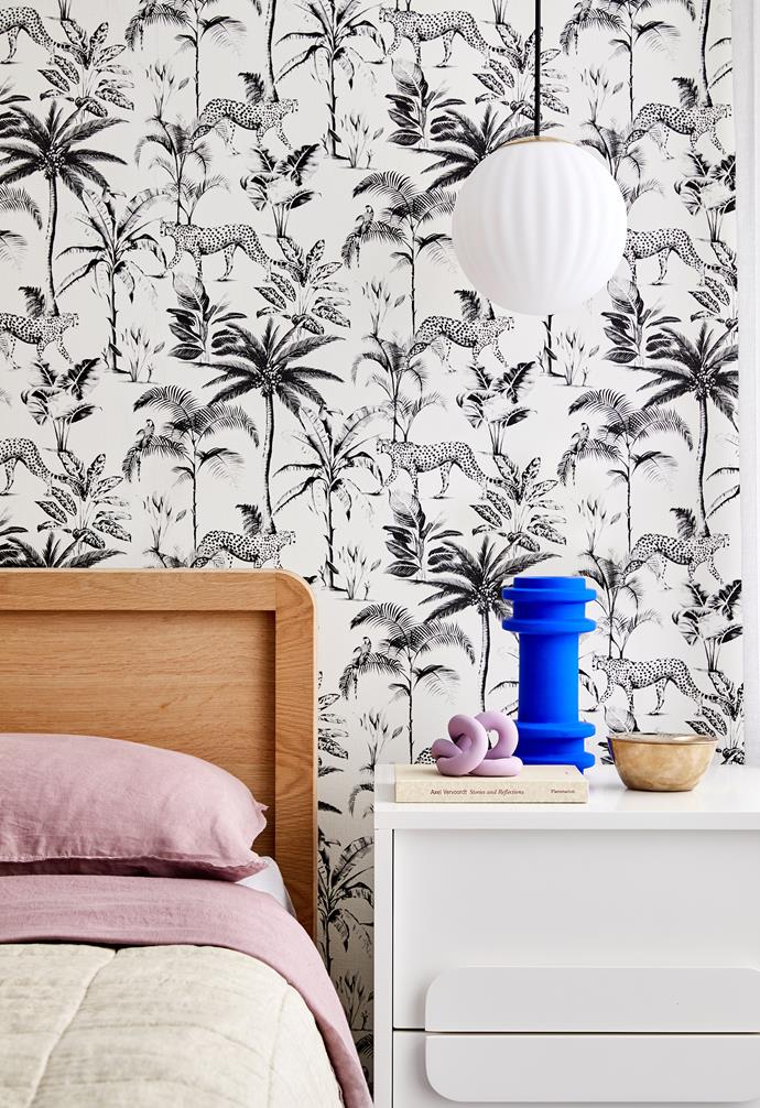 In the master bedroom, Natty + Polly wallpaper sums up Kristel's playful-yet-sophisticated ethos. The bedhead
is by Eva, the bedside table is from West Elm and the pendant light is by Nordic Tales. The room wouldn't be complete without a vase, sourced from Makers Mrkt.