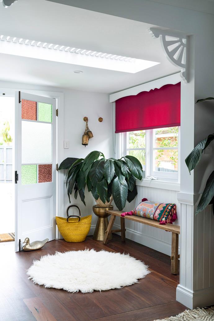 **ENTRY** "As every wall was painted white, I decided to go bold with the blinds," says Sarah. "I felt the need to add some character and interest in small doses." These mulberry hued blinds are called 'Carnival' in Ruby from Above & Beyond Shade Solutions. The bench was a vintage find, the sheepskin came from Etsy, the brass drum is from [Adairs](https://www.adairs.com.au/|target="_blank"|rel="nofollow") and the brass doorbell came from Temple & Webster.
