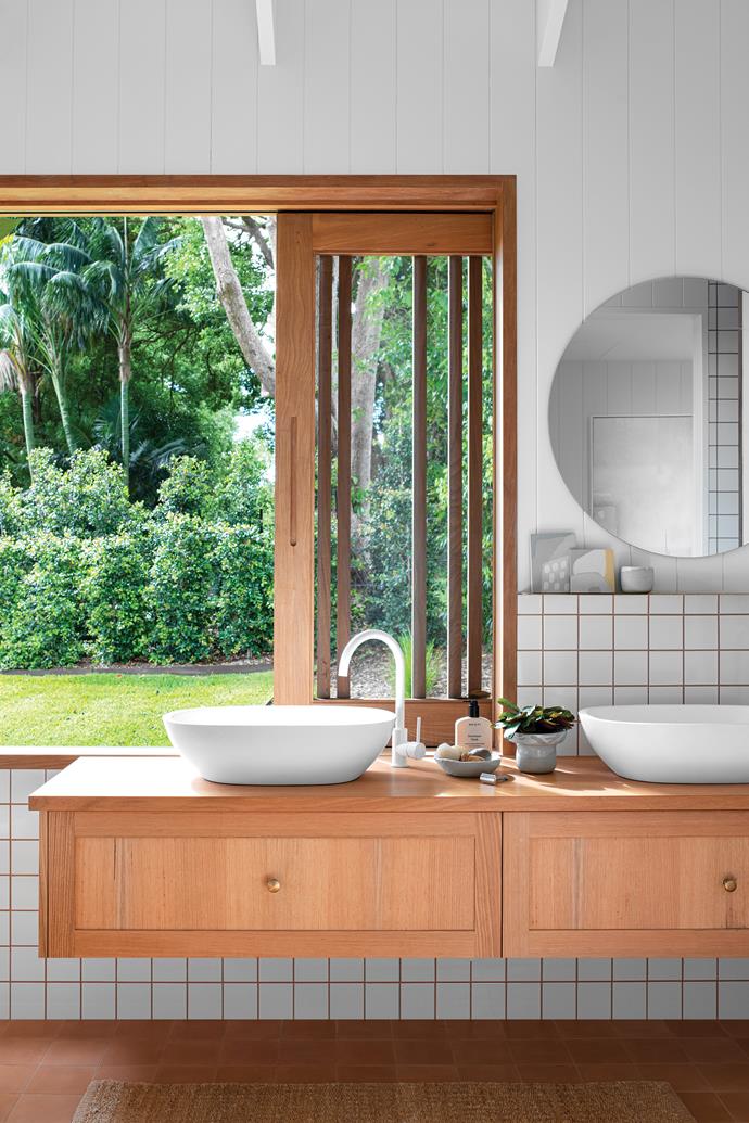 **Forest sanctuary** <br><br>Located in the [hinterland region of Byron Bay](https://www.homestolove.com.au/sustainable-home-byron-hinterland-23565|target="_blank"), this open-to-the-elements bathroom was designed by residing couple Lee-Anne and Lee, who run design and consulting firm Healthy Abode, specialising in non-toxic living.
<br><br>Despite being sustainable first and foremost, Lee-Ann and Lee have not skimped on design, creating a tactile palette of warm neutrals via materials and clever combinations of tile and [grout](https://www.homestolove.com.au/grout-cleaning-hack-22777|target="_blank").<br><br>A seamless connection to the home's yard which is skirted by forest-like surrounds provides complete privacy.<br><br>
