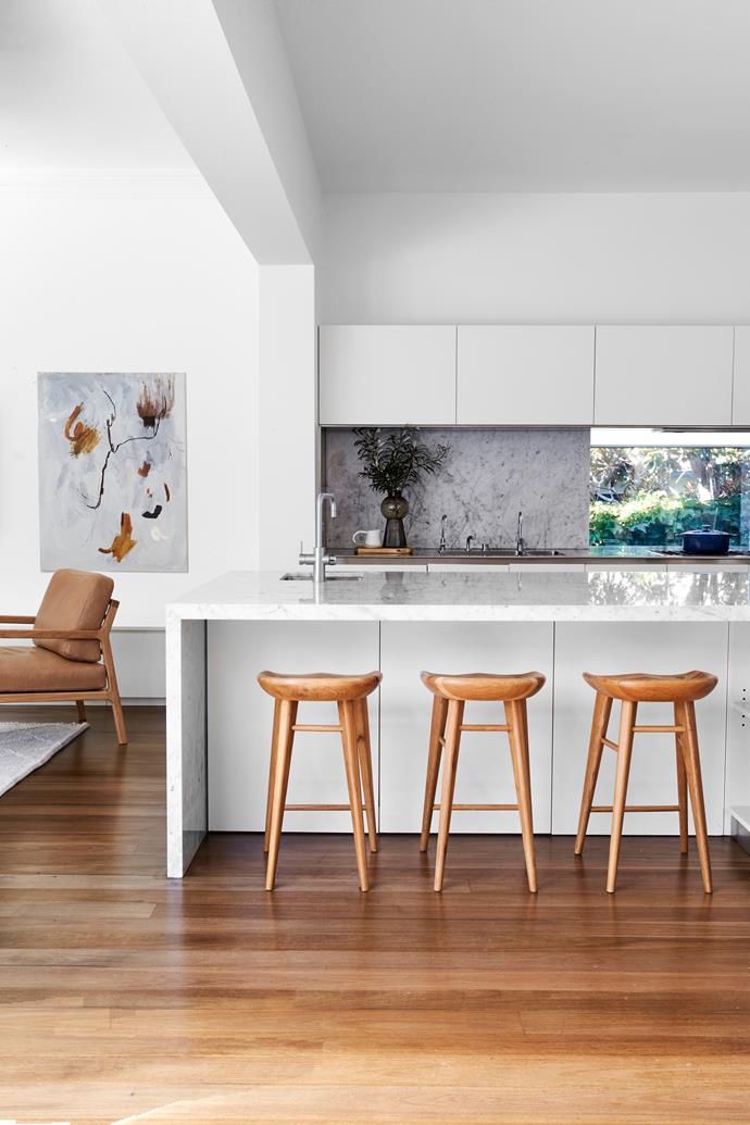 **KITCHEN** "We wanted it to be a space where Aaron and I can enjoy our love of cooking – and the kids love food! They can be around me when I'm preparing meals," says Lauren. Aaron and the two older children can perch on the 'Taburet' bar stools from [Life Interiors](https://lifeinteriors.com.au/|target="_blank"|rel="nofollow"). The picture window, looking into the garden, lends instant calm when things get a little hectic. In the adjoining family area, the 'Sketch Nysse' chair from Globe West and Anna Curnuck's mixed-media, nature-inspired artwork, Extract I, from [Sibu Gallery](https://sibu.gallery/|target="_blank"), add to the serene feeling.
