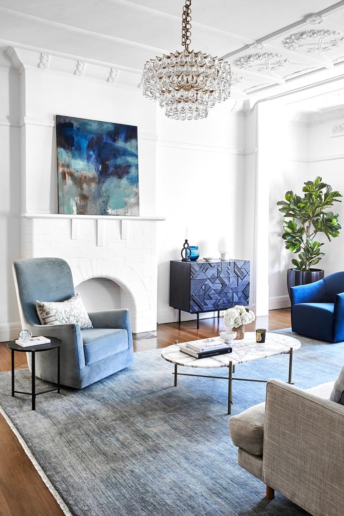 **FORMAL LIVING** The custom armchair from [H + J Furniture](https://hjfurniture.com.au/|target="_blank"|rel="nofollow"), 'Juno Florence' armchair from Globe West and 'Agra' rug in Marlin from Armadillo, as well as the Orkney artwork by Eva Frengstad, from Sibu Gallery, add drama. The Ethnicraft 'Graphic' chest of drawers is from [Trit](https://www.trithouse.com.au/|target="_blank"|rel="nofollow"), 'Liscia' chandelier from [Montauk Lighting Co](https://www.montauklightingco.com/|target="_blank"|rel="nofollow").