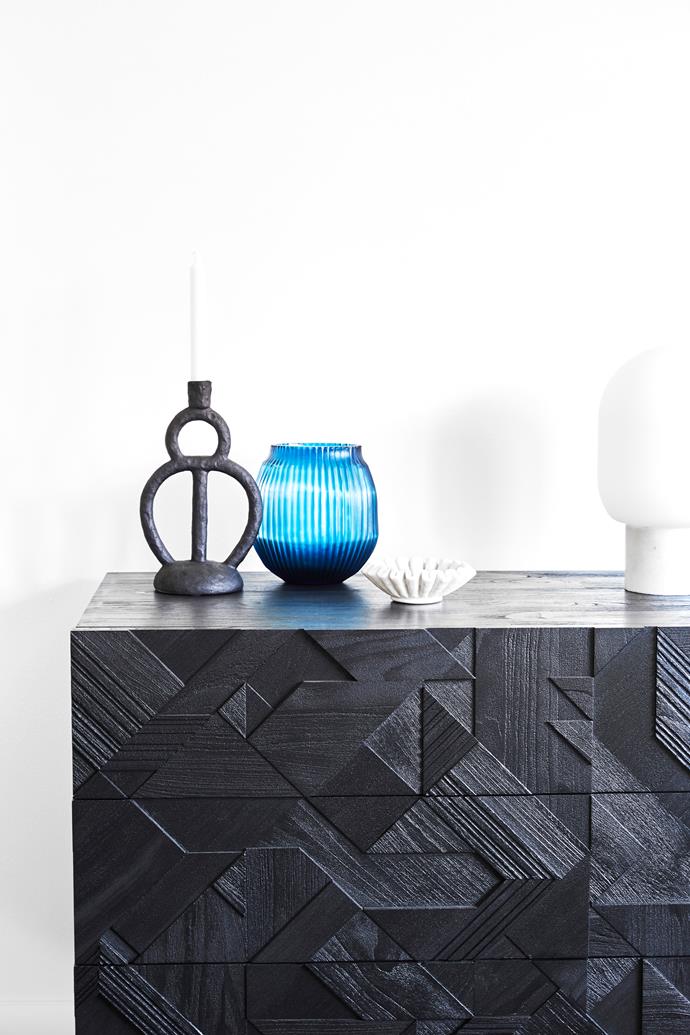 On the Ethnigraph 'Graphic' chest of drawers, is a 'Karl' polyresin candle holder, from Trit, and a cut-glass vase by Brian Tunks from [Bisonhome](https://www.bisonhome.com/|target="_blank"|rel="nofollow").