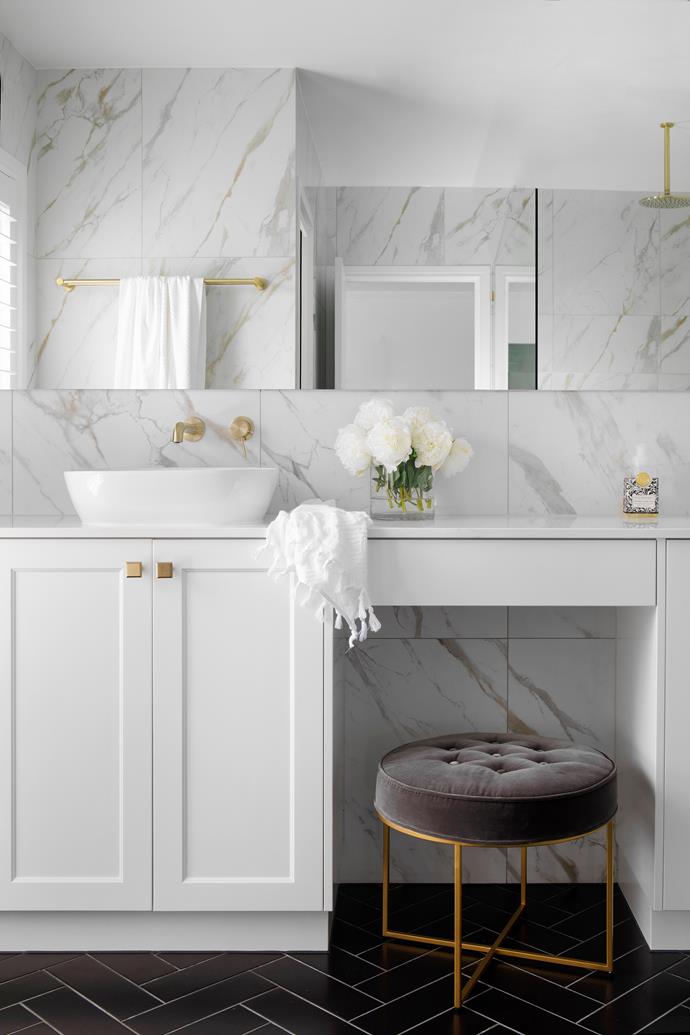 **ENSUITE** Previously awash in dated peach- and cream-toned tiles, Josephine and Bryant's ensuite was revived with 'Executive Stone' honed Calacatta marble tiles from [Stone World](https://www.stoneworld.com.au/|target="_blank"|rel="nofollow"), with black matt RAL floor tiles laid in a herringbone pattern for contrast. A double vanity in Michelangelo quartz from WK Quantum Quartz features ACL Co 'Cora' basins with Nero 'Mecca' tapware (try Tradelink) and gold drawer hardware from Handle House. Reflected in the mirror is a Nero 'Bianca' towel rail.