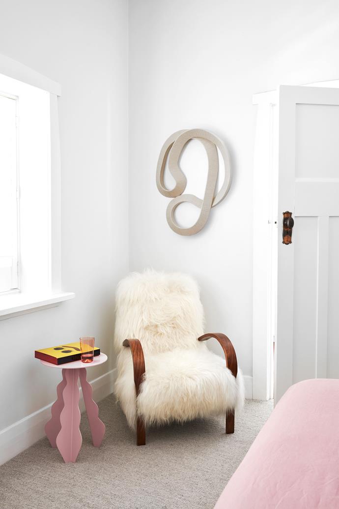Above an 'Icelandic' sheepskin armchair and 'Frill' table by MakeBelieve, both from CCSS, is a textile-wrapped sculpture by Ivana Taylor from Gallery Sally Dan-Cuthbert.
