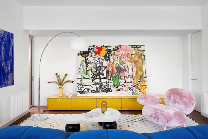 Zac Segbedzi's Sauersazobomb dominates the living area on a USM 'Haller' sideboard, and the colour continues with a Ligne Roset 'Plumy' sofa from Domo and an Edra 'Cipria' armchair from Space. 'Lucha' pink lamp from Makers' Mrkt and standing lamp from Didi & Dora. Jardan x Yeend 'Sugarpill' vessel on the coffee table.