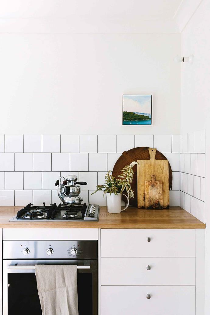 This quaint kitchen was designed using tiles and cupboards from Bunnings!