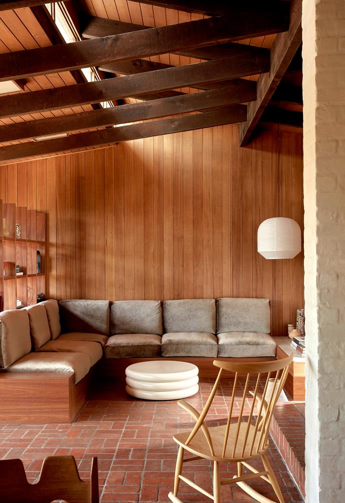 The dark terracotta brick flooring was a detail this couple retained when renovating [this unique "bush modernism"-inspired home](https://www.homestolove.com.au/mid-century-bush-inspired-home-23467|target="_blank") in Melbourne. Their moodboard for the space was all about achieving an earthy palette, which the bricks helped with. 