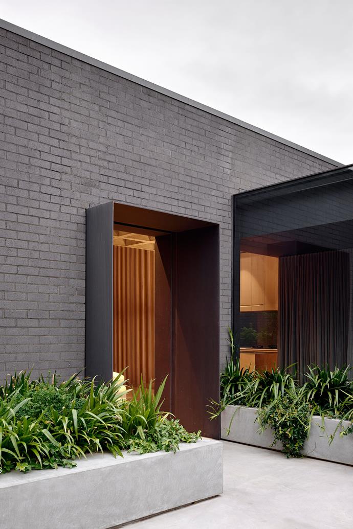 Bold yet sympathetic design elements have allowed old and new to meld in [this period Arts and Craft-style home](https://www.homestolove.com.au/striking-update-arts-and-craft-style-home-23332|target="_blank") in Hawthorn's heritage-listed Grace Park Estate. One of the design cues for the distinctive concrete coffered ceiling in the new kitchen and living areas came from the original grid-like timber strapping in the entrance.


