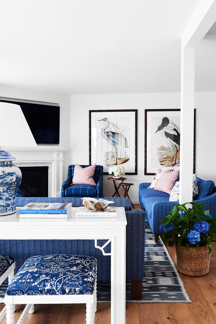 **LIVING AREA** Chris wanted to use as many Australian designers as possible, especially [Anna Spiro Textiles](https://www.annaspirotextiles.com.au/|target="_blank"|rel="nofollow"), whose bright and cheerful fabrics light up almost every room in the home. Custom footstools by Maine House Interiors and custom sofas and armchairs from [Arthur G](https://www.arthurg.com.au/range|target="_blank"|rel="nofollow") all use Diane Bergeron fabric. On the custom console, also by Maine House Interiors, is a 'Temple' lamp from Provincial Home Living. The Dash & Albert rug, from [Winton House](https://wintonhouse.com.au/|target="_blank"|rel="nofollow"), and the artworks, from Designer Boys, provide further jolts of deep blue.