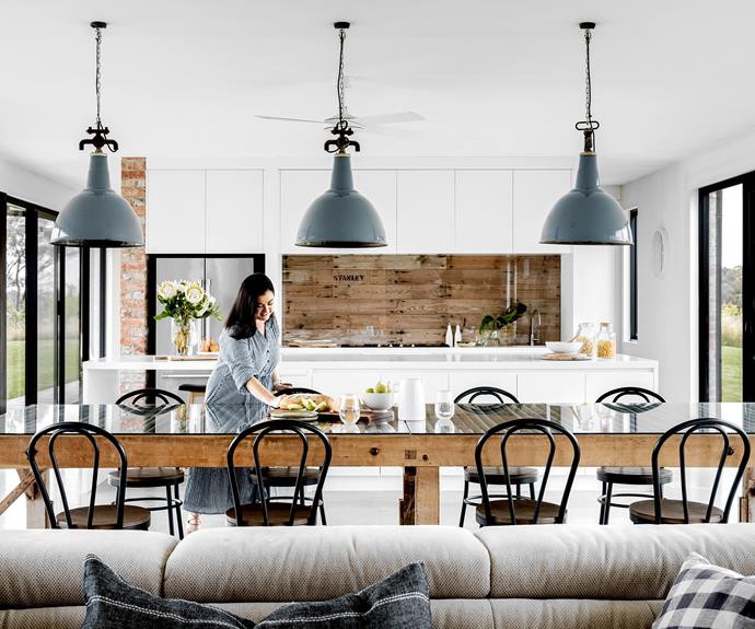 The dining table was once a wool-classing table and the lights above it came from an [old wool shed](https://www.homestolove.com.au/shed-house-ideas-21540|target="_blank").