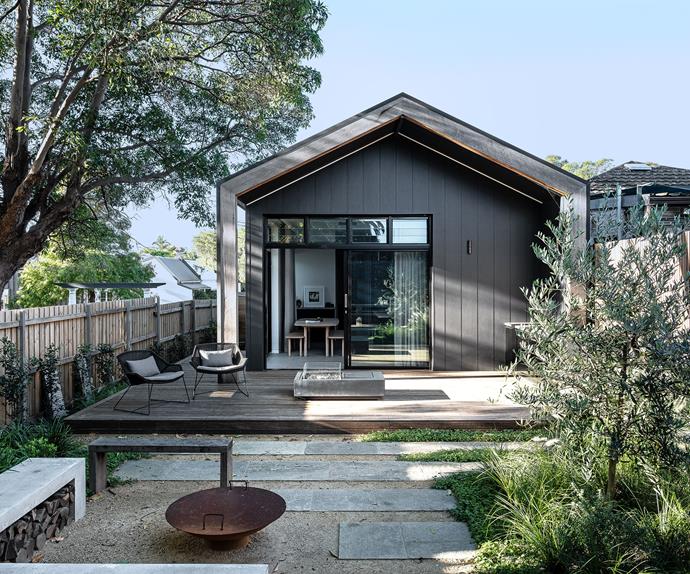 modern extension on the back of a Federation cottage with a leafy backyard planted with natives