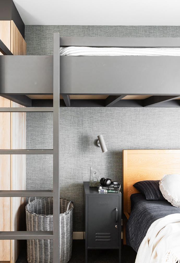 "The builders constructed the loft bed from a drawing I gave them and [Luxe Joinery](https://luxekitchens.com.au/|target="_blank"|rel="nofollow") installed Ben's wardrobes," says Anna. "The bed is painted [Taubmans](https://www.taubmans.com.au/|target="_blank"|rel="nofollow") Knight Grey with timber for the lower bedhead." Strand bed, [Uniqwa Collections](https://uniqwacollections.com.au/|target="_blank"|rel="nofollow"). Side table, [Mustard](https://mustardmade.com/|target="_blank"|rel="nofollow"). MIB 6 wall light, [Urban Lighting](https://urbanlighting.com.au/|target="_blank"|rel="nofollow"). Casamance 'Shinok' wallpaper, [Zepel Fabrics](https://zepelfabrics.com/|target="_blank"|rel="nofollow").