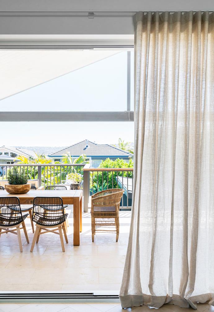 "The house is oriented east-west, so we added the generous balcony at the rear," says Anna. "We often eat out there as it is shaded and the sunsets are gorgeous." The table was a wedding gift from Anna's parents. Lakes chairs, [Satara](https://www.satara.com.au/|target="_blank"|rel="nofollow"). Arbon limestone pavers, [Eco Outdoor](https://www.ecooutdoor.com.au/|target="_blank"|rel="nofollow").