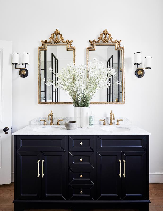 The ensuite bathroom in stylist [Steve Cordony's sprawling country estate](https://www.homestolove.com.au/stylist-steve-cordonys-chic-country-home-22083|target="_blank") embraces the home's historic story and combines oregon floorboards, antique mirrors and flowers picked straight from the garden outside. It's the perfect blending of contemporary and traditional style. 
