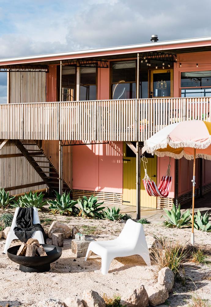 The idyllic holiday home is part of a single row of waterfront beach shacks.