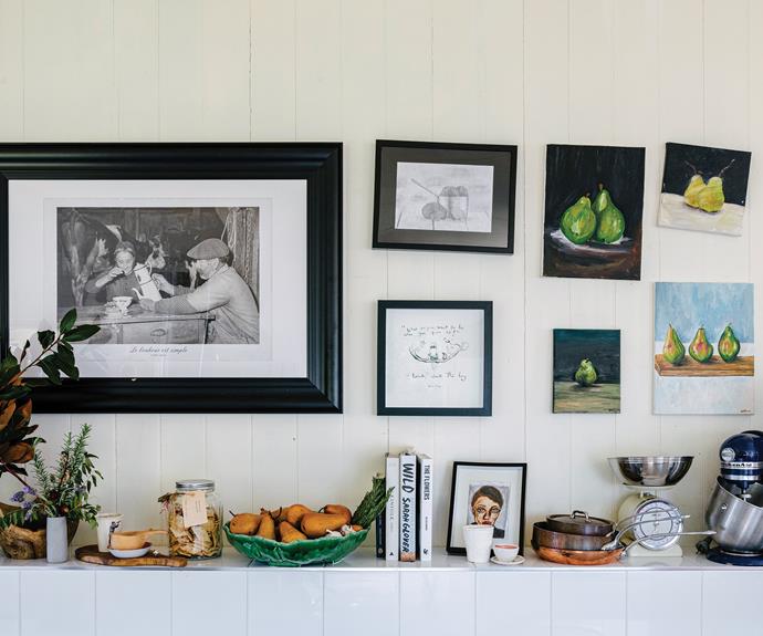 The pear paintings are by Natalie's daughters, Briony and Kiana, while the Charlie Mackesy print was gifted by a friend. The portrait art is also by Briony. Natalie purchased her trusty KitchenAid appliance in Germany 29 years ago.