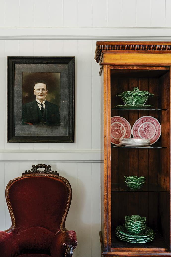 A framed photo bought in Katoomba, NSW, hangs above an antique French chair. The Wedgwood plates were a Marketplace find, while the Cabbageware is by Dee Muir Designs in Rockhampton.