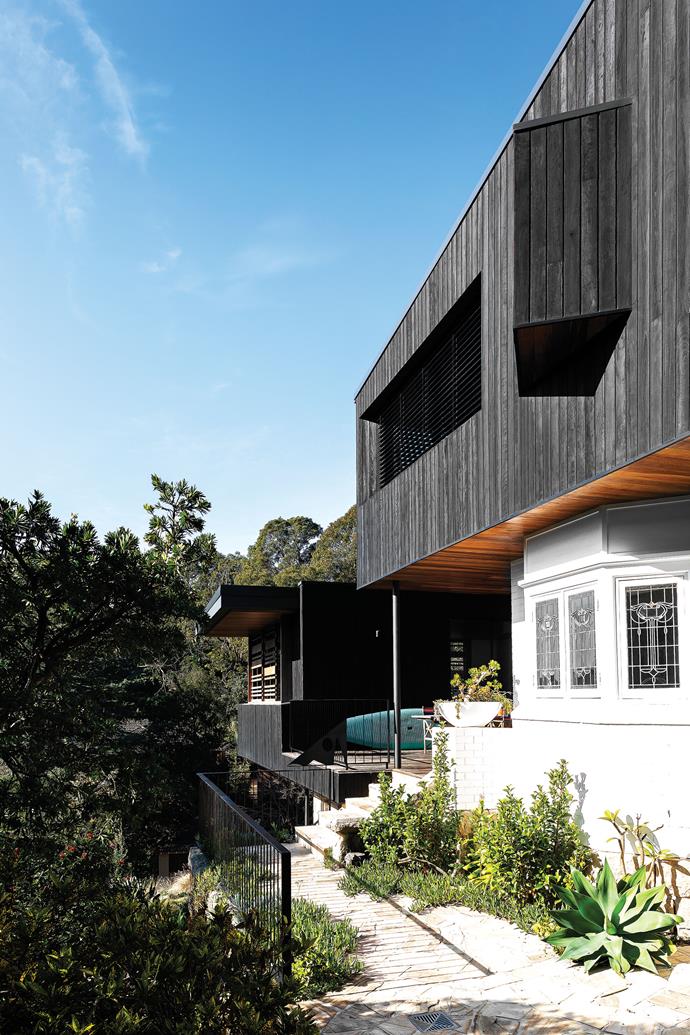 **FRONT:** The owner, architect Alexandra Mowday, redesigned the home with an upper floor to capture views and breezes. The charred timber cladding was supplied by [Eco Timber Group](https://www.ecotimbergroup.com.au/|target="_blank"|rel="nofollow"). Manna Landscapes reworked the garden from a design by Emily Simpson.