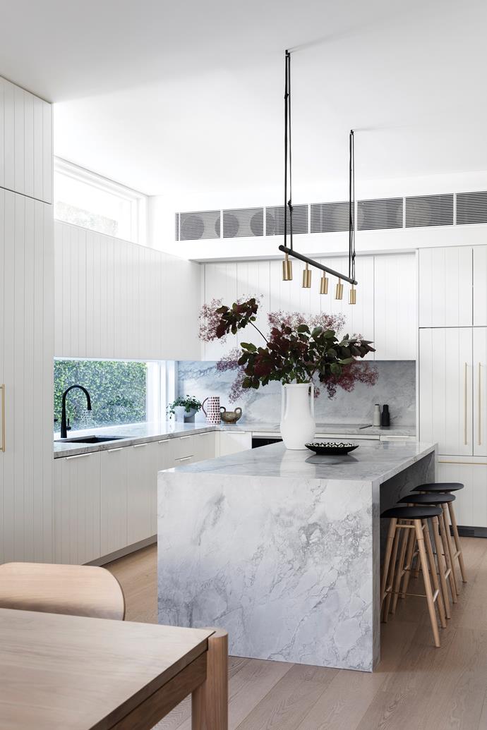 Super white dolomite stone makes the island bench an attractive centrepiece. The Long John pendant light is from [Fred International](https://fredinternational.com.au/|target="_blank"|rel="nofollow"). Stools, [Catapult Design](https://www.catapultdesign.net.au/|target="_blank"|rel="nofollow"). Vase and accessories, [MCM House](https://www.mcmhouse.com/|target="_blank"|rel="nofollow") and [Luumo Design](https://luumodesign.com/|target="_blank"|rel="nofollow").