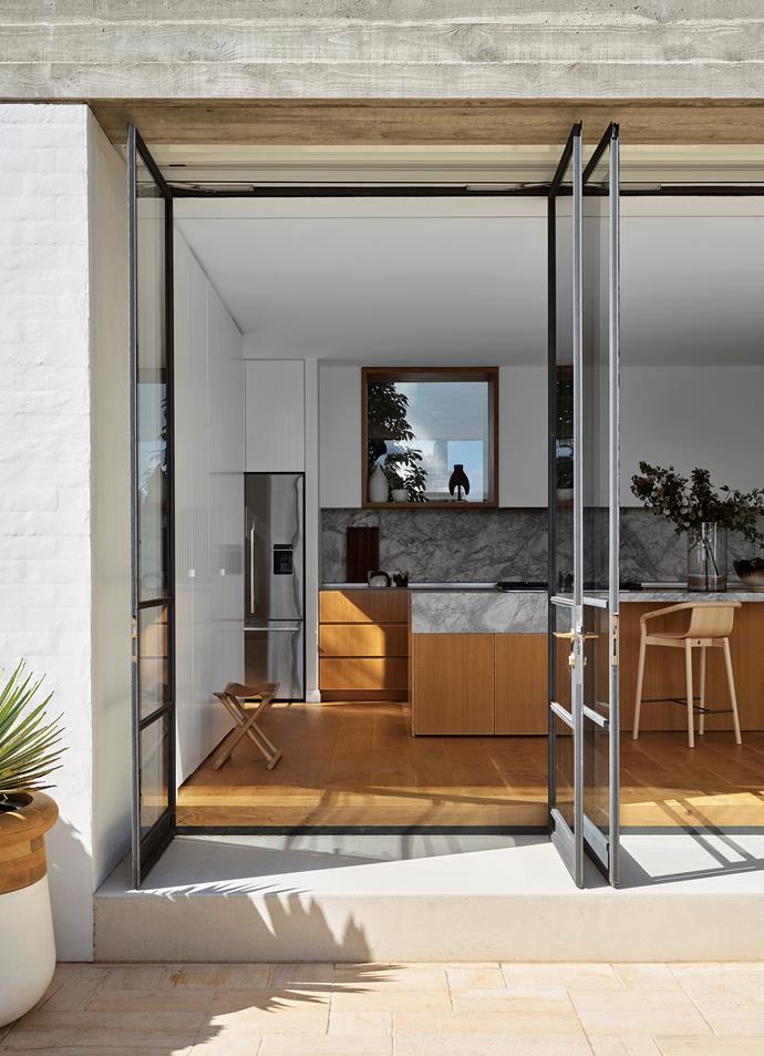 French-style steel and glass doors swing open to allow the breeze into [this Mediterranean-style home](https://www.homestolove.com.au/1950s-home-mediterranean-style-makeover-22097|target="_blank") in Castlecrag, while creating a seamless indoor outdoor flow.
