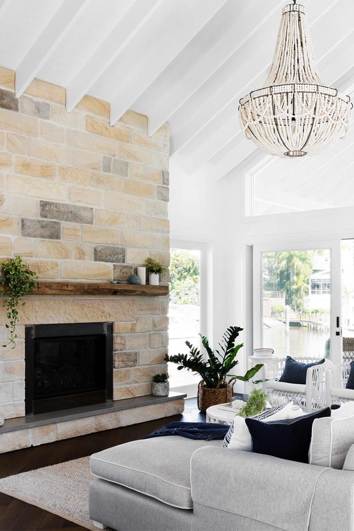 "Rather than stress about wear and tear, I opted for durable finishes and materials," says the homeowner of [this coastal-meets-farmhouse family home](https://www.homestolove.com.au/gold-coast-holiday-inspired-family-retreat-23115|target="_blank") on the Gold Coast. While the fireplace was the biggest splurge, the hand-cut natural stone creates a much better feel than pre-fabricated cladding would. 