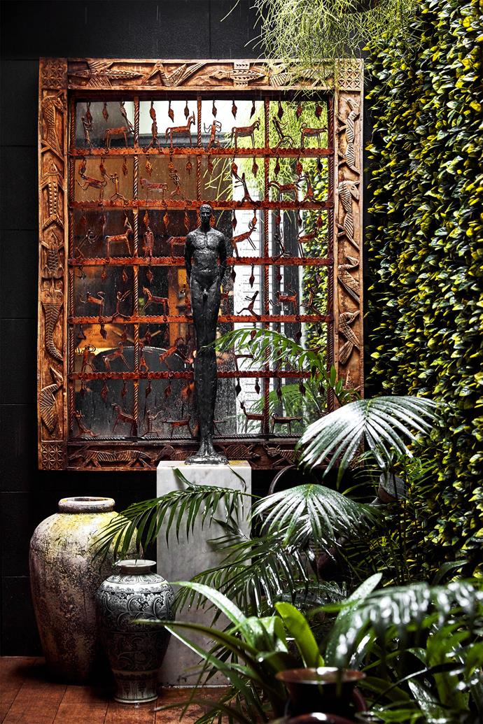 Antique Indian screen, over-wall mirror, and pots, all Orient House. Male Reveal II sculpture by Tom Corbin, Studio Cavit. Carrara marble plinth, Granite & Marble Works.