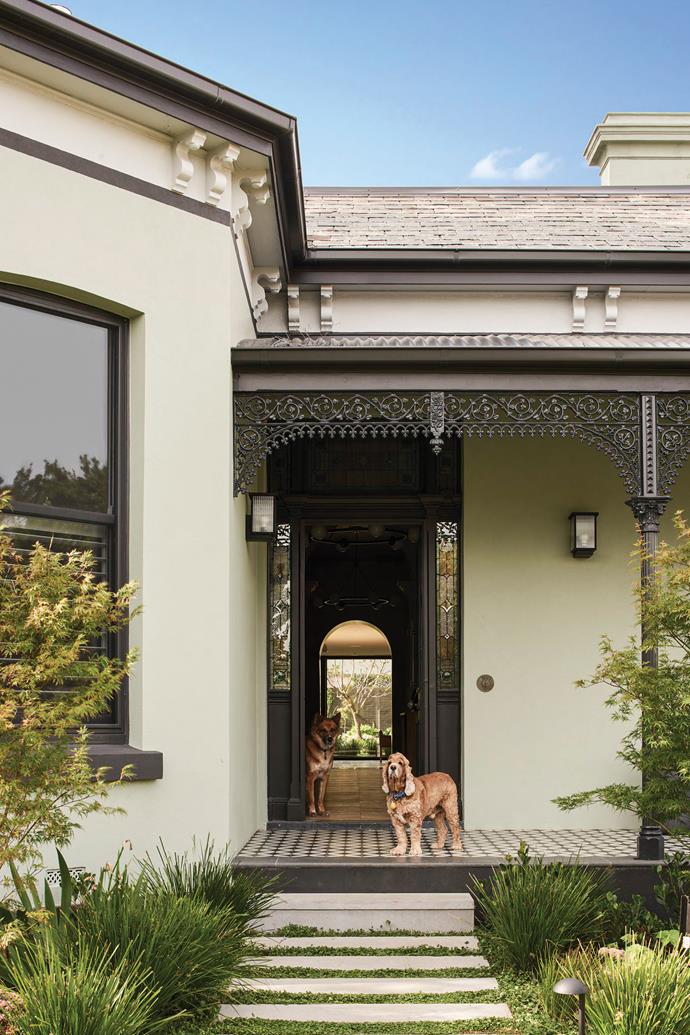 The front of the house was restored to its former glory with a new wrought-iron fence, a more [formal garden](https://www.homestolove.com.au/the-5-elements-needed-to-create-a-formal-garden-1907|target="_blank") and new paintwork in [Dulux](https://www.dulux.com.au/|target="_blank"|rel="nofollow") Ramona, a greyish green. "We put a lot of thought into the exterior colour as we didn't want to do white or grey because everyone does that," says Sarah. "We decided on green but, as we were overseas at the time, had to rely on video footage of the seven samples that had been painted on the outside. We just had to go for it and hope we'd got it right. Luckily, we really love the colour."