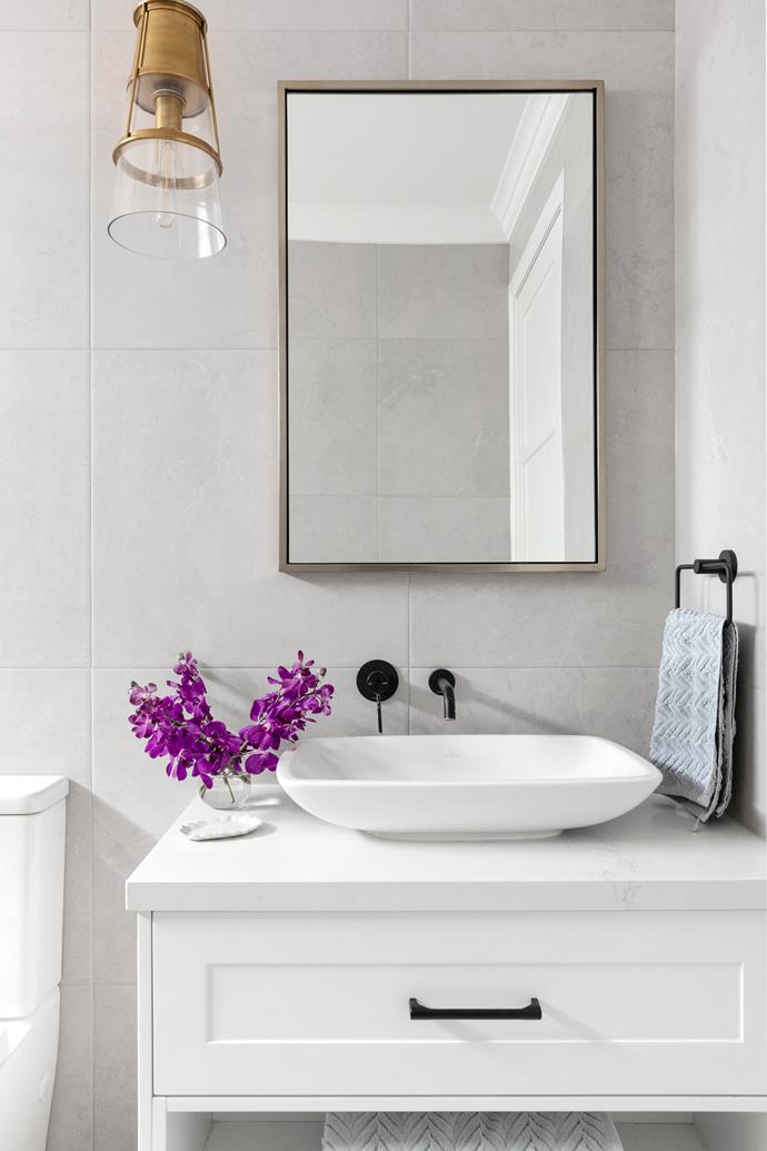 **POWDER ROOM** A custom vanity in the [powder room](https://www.homestolove.com.au/how-to-create-the-perfect-powder-room-22684|target="_blank") echoes the Shaker profile featured throughout the home, with a Villeroy & Boch 'Loop & Friends' sink, 'Maximo White' wall tiles from Beaumont Tiles and a pendant from [The Montauk Lighting Co](https://www.montauklightingco.com/|target="_blank"|rel="nofollow").