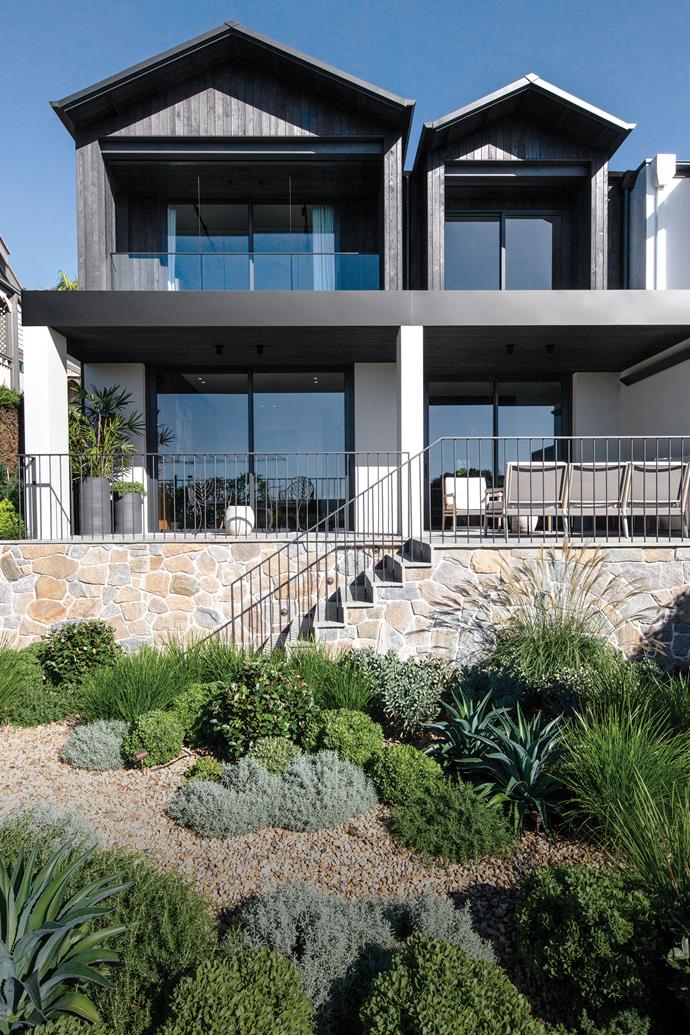 The home's facade comprises Cambia Ash from [Britton Timbers](https://brittontimbers.com.au/|target="_blank"|rel="nofollow") and Howqua Freeform stone cladding from [Eco Outdoor](https://www.ecooutdoor.com.au/|target="_blank"|rel="nofollow"). In addition to the succulents and grasses are Miscanthus sinensis 'Adagio' and some hardy thorny olive shrubs (Elaeagnus pungens).