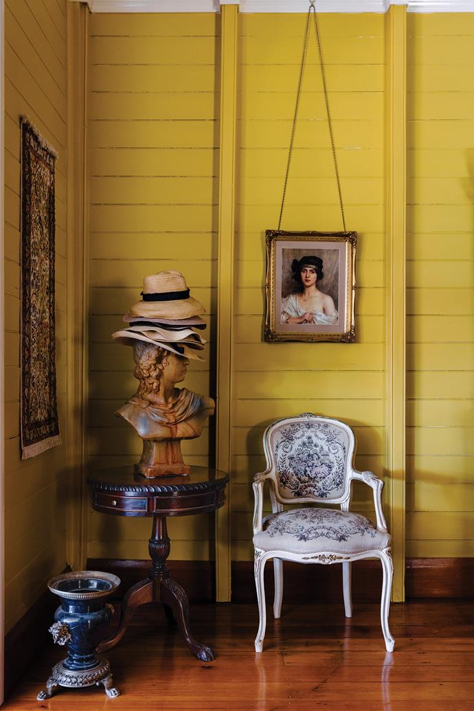 A quaint nook in the dining room showcases antique art and furniture.