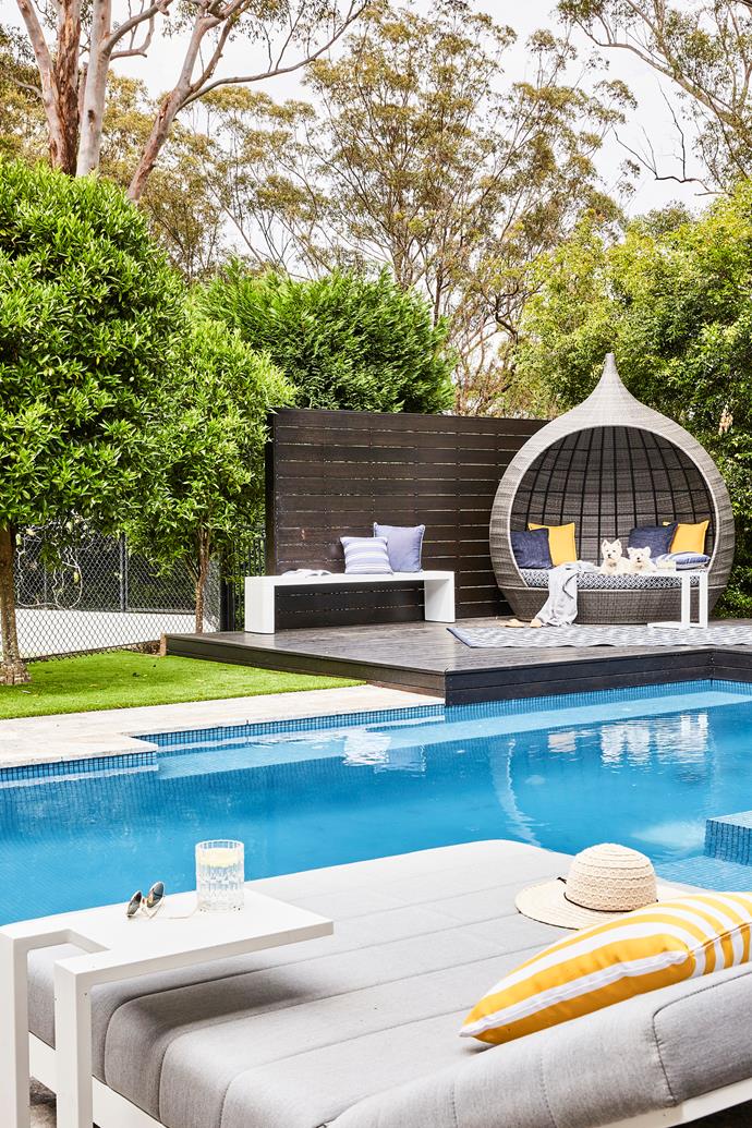 **OUTDOOR AREA** When the pool was first built, the budget didn't stretch to all the "nice but not necessary additions". Twenty years later, Sonia and Michael could choose exactly what they wanted and opted for a fully tiled pool interior featuring a blue glass mosaic mix from Industrie Tapware. The surrounds were updated with 'Silver Travertine' French pattern tiles, also from Industrie Tapware, and an outdoor sofa from Lounge Lovers. Westies Maisie and Poppy love to hang out poolside on a [daybed](https://www.homestolove.com.au/daybed-ideas-19586|target="_blank") from [Osmen Outdoor Furniture](https://osmen.com.au/|target="_blank"|rel="nofollow").