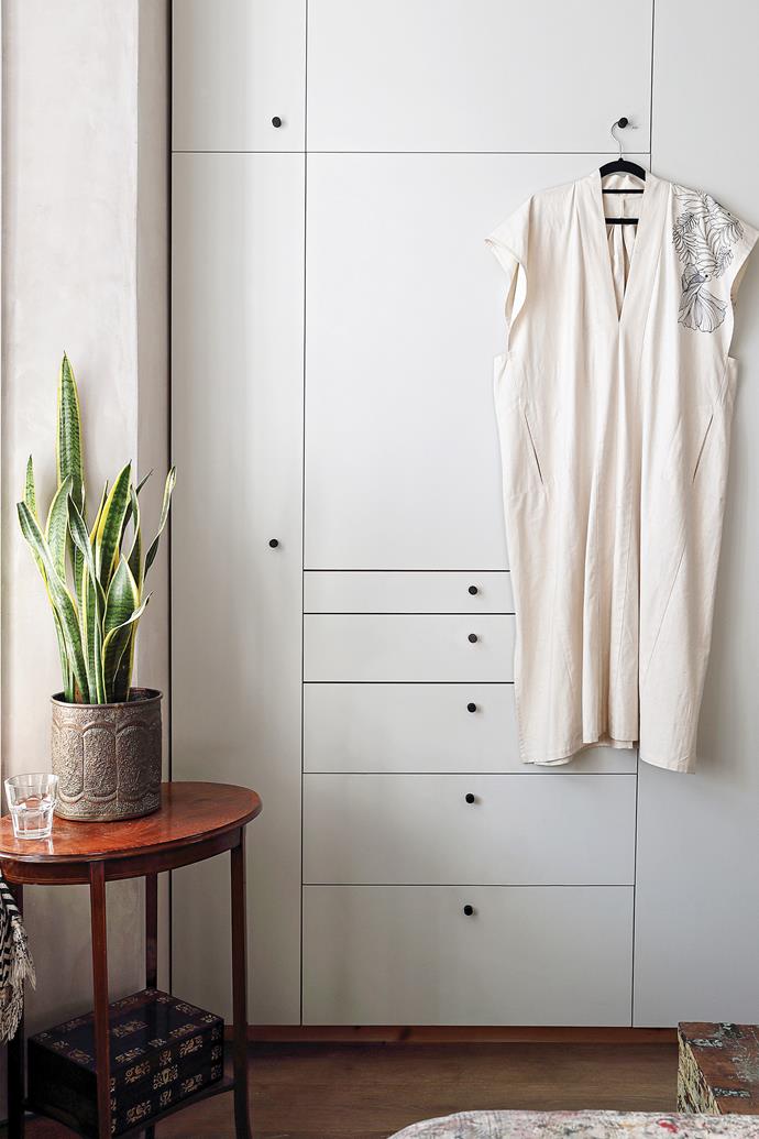 Mallika and Sean's floor-to-ceiling wardrobes are a vortex of storage, including bespoke drawers designed specifically for Mallika's jewellery.