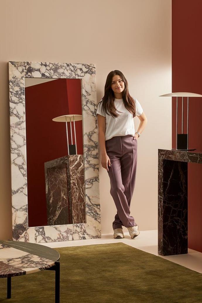 Adele Cotruzzola standing beside her breathtaking [Brera floor mirror](https://www.justadele.com.au/products/brera-floor-mirror|target="_blank"|rel="nofollow"). 