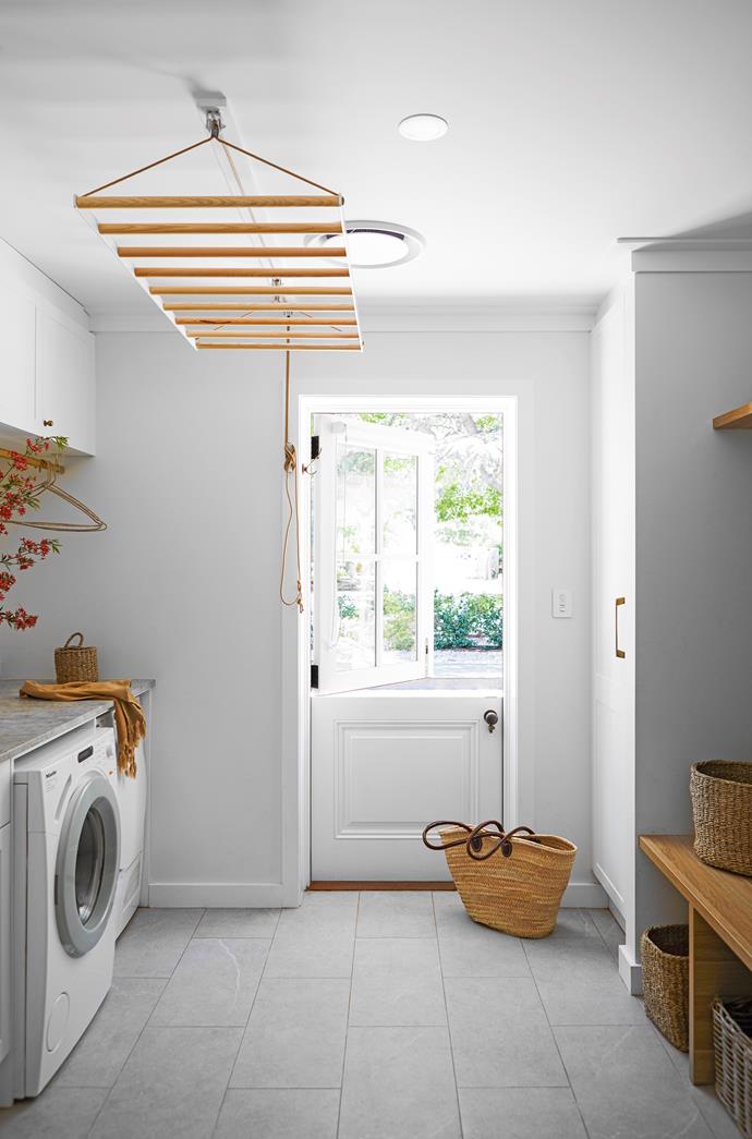The laundry doubles as a [mudroom](https://www.homestolove.com.au/mudroom-design-6620|target="_blank"), with a custom Dutch door by [Evalock](https://evalock.com.au/|target="_blank"|rel="nofollow").