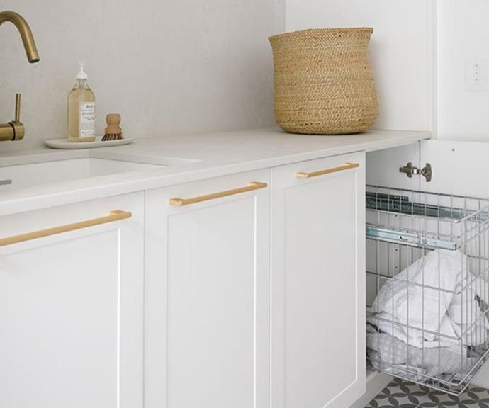 Integrated wire laundry baskets keep the space tidy, eliminating the need for hampers.