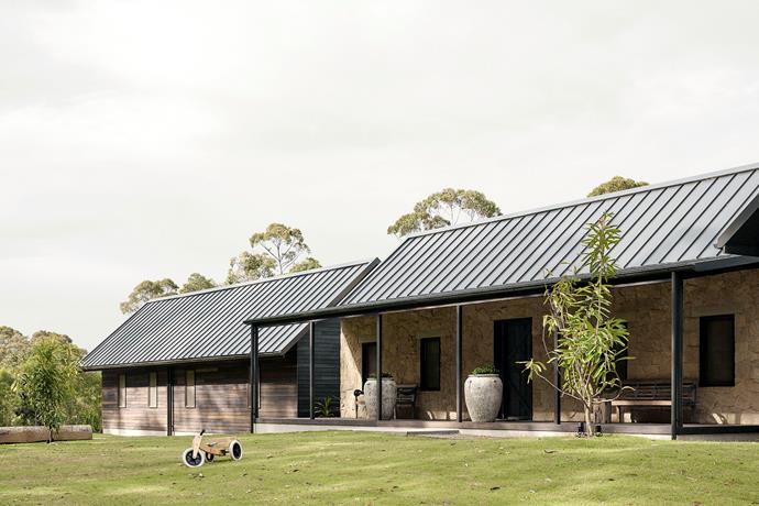 "The principal inspiration for the house was early Noosa buildings with their elegant gable roofs and timber construction," says architect David Teeland. The exterior comprises spotted gum hardwood, 'Bodega' stone from Eco Outdoor and Stramit 'SharpLine' roofing. Landscaping by Steven Clegg Design. The urns on the deck are from Ancient Athens Pots.