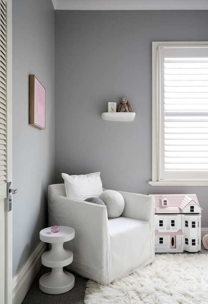 Wool carpet from Bremworth replaces timber flooring in daughter Sienna's nursery, which features more cabinetry that's been designed by Olivia and manufactured with a white polyurethane finish, mirror splashback and glossy handles by Brindabella Kitchens.