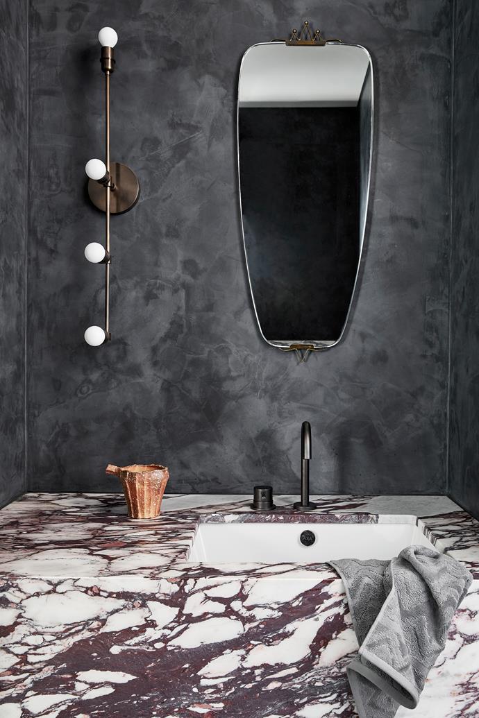 **POWDER ROOM** A vintage mirror from [1stdibs](https://www.1stdibs.com/|target="_blank"|rel="nofollow") is a great fit in this moody space. The special wall finish is Porter's Fresco in Caspian Sea, carried out by [Hermosa Painting Finishes](http://hermosafinishes.com.au/|target="_blank"|rel="nofollow"). Apparatus 'Vanity' sconce, [Criteria Collection](https://criteriacollection.com.au/|target="_blank"|rel="nofollow"). Ceramic vessel, [The DEA Store](https://thedeastore.com/|target="_blank"|rel="nofollow"). Missoni hand towel, [Spence & Lyda](https://www.spenceandlyda.com.au/|target="_blank"|rel="nofollow").