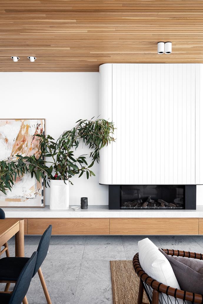 In the living room of [this waterfront weekender](https://www.homestolove.com.au/northern-beaches-waterfront-weekender-new-build-23413|target="_blank"), an Escea 'DS Series' fireplace by Stoke floats above the marble floor. 