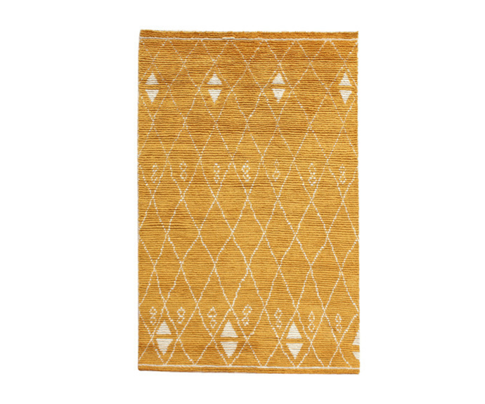 **[Marigold Ostin hand-knotted wool blend rug, from $659, Temple & Webster](https://click.linksynergy.com/deeplink?id=bbwaLgc15mM&mid=41108&murl=https://www.templeandwebster.com.au/Marigold-Ostin-Hand-Knotted-Wool-Rug-TPWT2815.html&u1=homestolove.com.au/stylish-rugs-to-sweep-you-off-your-feet-7130|target="_blank"|rel="nofollow")**<br>
Crafted and hand-knotted from durable wool, this buttercup-toned rug is the ideal statement maker. A subtle geometric pattern hints at a Moroccan influence, while the neatly finished edges make it perfect for contemporary living. **[SHOP NOW](https://click.linksynergy.com/deeplink?id=bbwaLgc15mM&mid=41108&murl=https://www.templeandwebster.com.au/Marigold-Ostin-Hand-Knotted-Wool-Rug-TPWT2815.html&u1=homestolove.com.au/stylish-rugs-to-sweep-you-off-your-feet-7130|target="_blank"|rel="nofollow")**