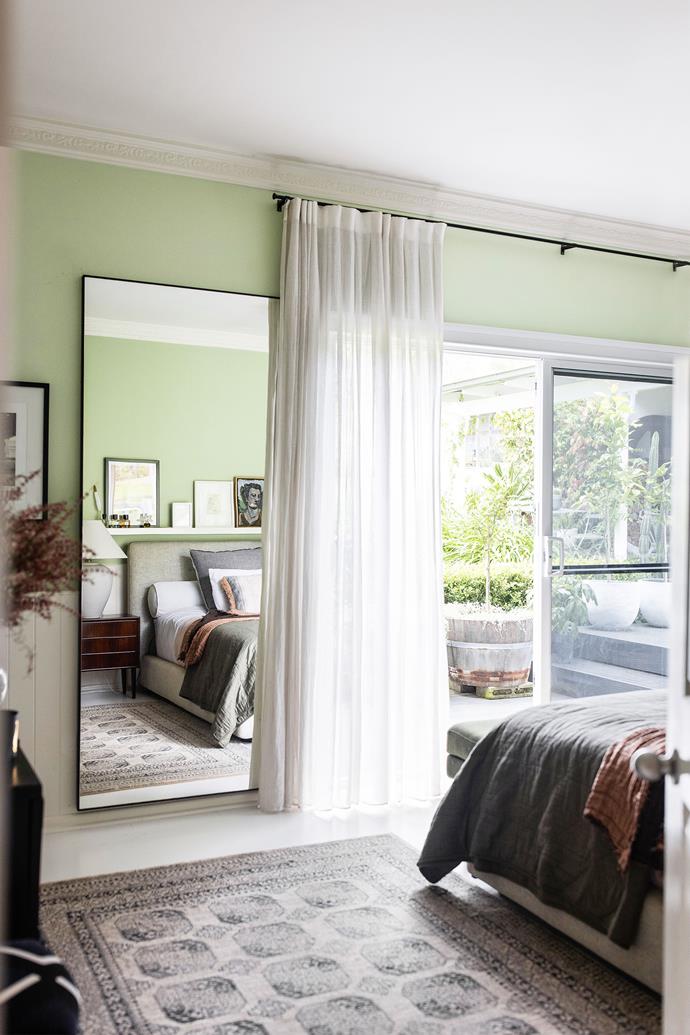 Walls in the master bedroom are painted Dulux Pale Sage: "It's gentle, restful and brings the outside in," says Neale. Serenade bed, King. Mid-century bedside tables, Vampt Vintage Design. Curtains, Luxaflex Window Fashions.