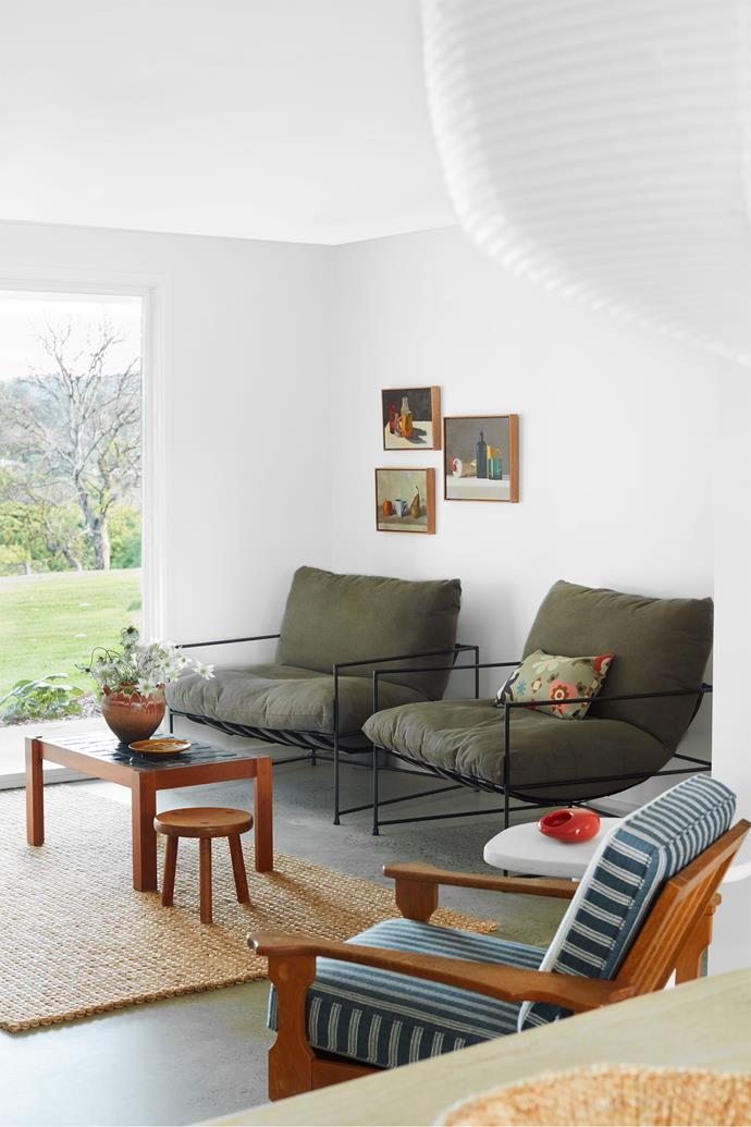 "Portuguese country beach house style was the language for furniture, art, fittings and finishes," says Justine Hugh-Jones, founding principal of interior design firm Hugh-Jones Mackintosh, of [her holiday home](https://www.homestolove.com.au/holiday-home-byron-hinterland-23716|target="_blank") in the Byron hinterland. "These rustic homes tend to be one level and very casual with polished concrete floors, whitewashed interiors, colourful mid-century vintage furniture and lots of wood and wicker."