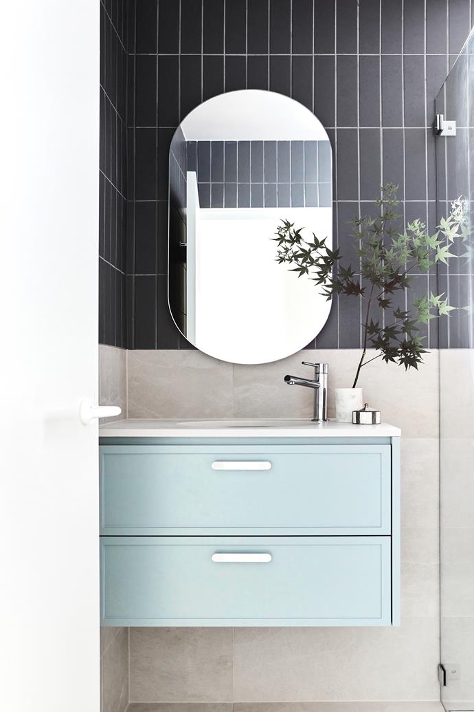 Two-tone walls put the focus on both materials: Bianco Naturale tiles by Eureka Stone to hip height and a Lingotti Denim Matt design above, both from [Di Lorenzo](https://dilorenzo.com.au/|target="_blank"|rel="nofollow"). Vanity, custom design in [Dulux](https://www.dulux.com.au/|target="_blank"|rel="nofollow") Calandre with Caesarstone bench in Cloudburst Concrete. ADP mirrored cabinet, [Reece](https://www.reece.com.au/|target="_blank"|rel="nofollow").
