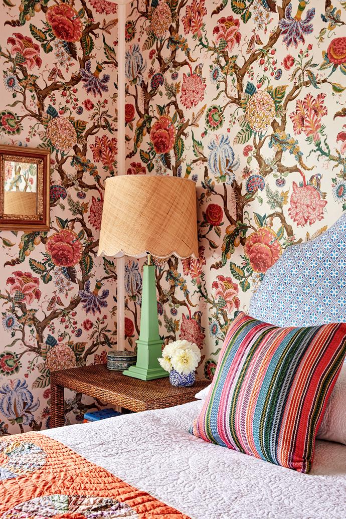 **MAIN BEDROOM** A mirror, once owned by Clare's parents, overlooks the romantic bedside curation. "The white trims running down the corners [of the walls] work well to break up the busyness of the [floral wallpaper](https://www.homestolove.com.au/how-to-decorate-with-florals-2434|target="_blank")," explains interior designer Penny Sheehan.