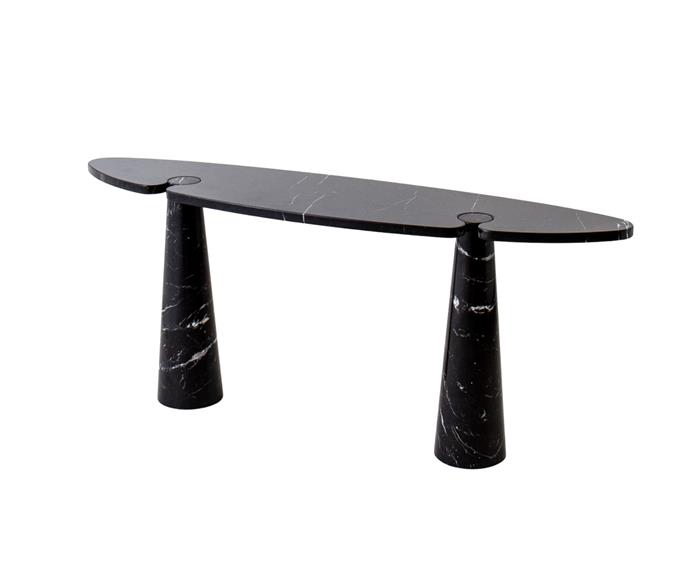 Melbourne gallery Nicholas & Alistair's Italian 'Eros' console by Mangiarotti was crafted from Nero Marquina marble in 1971, and features a half-ellipse top and two conical legs. **[SHOP HERE](https://nicholasandalistair.com/tables/eros-console-by-mangiarotti/|target="_blank"|rel="nofollow")**.

