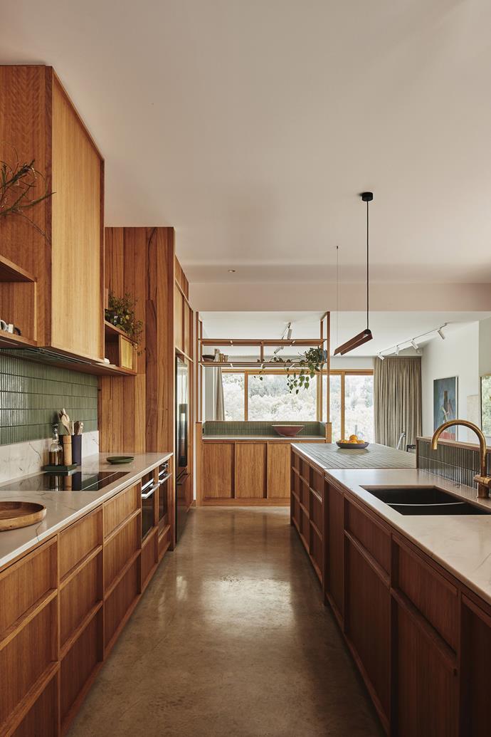 The light-filled kitchen sits between the dining space and living room.