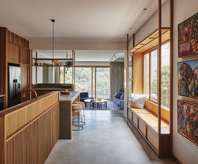 The brilliant architecture of [this future-proof Northcote home](https://www.homestolove.com.au/west-bend-house-mrtn-23814|target="_blank") has carefully zoned areas for work, play, cooking and entertaining, all within the one open-plan space. We can't imagine walking past this oversized timber picture window without the urge to sit down and chat with whoever's in the kitchen. Genius!