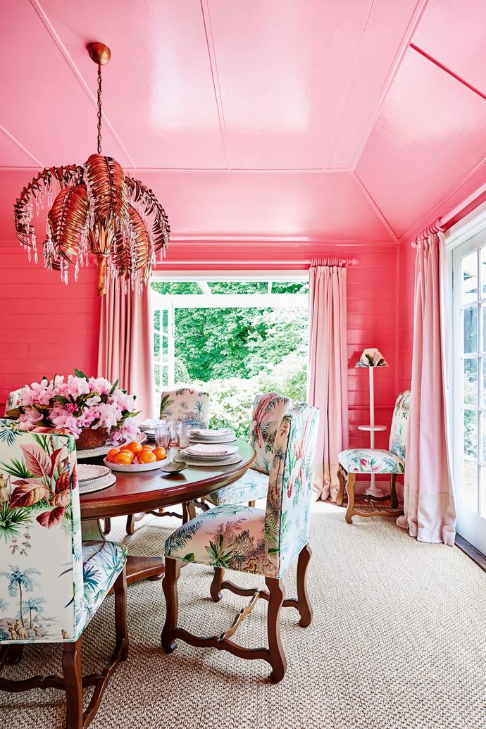Inspired by the garden's pink rhododendrons, Charlotte had the dining room painted in Resene 'Glamour Puss'. The [chandelier](https://www.homestolove.com.au/chandeliers-12938|target="_blank") was made in London in copper leaves and hand-cut Italian crystal.
