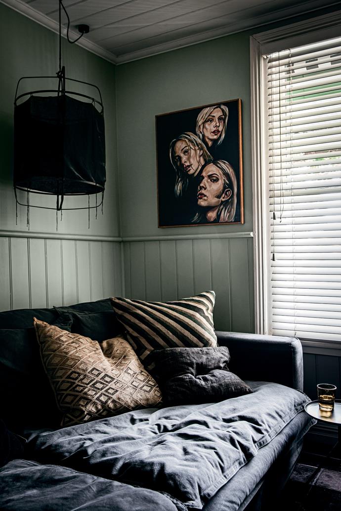 A huge sofa covered in army canvas is a cosy nook for relaxing. "You can put your muddy boots on it, doesn't matter," homeowner Simon Carver says. Artwork by Melbourne painter [Gavin Brown](https://www.gavinbrown.com.au/|target="_blank"|rel="nofollow").