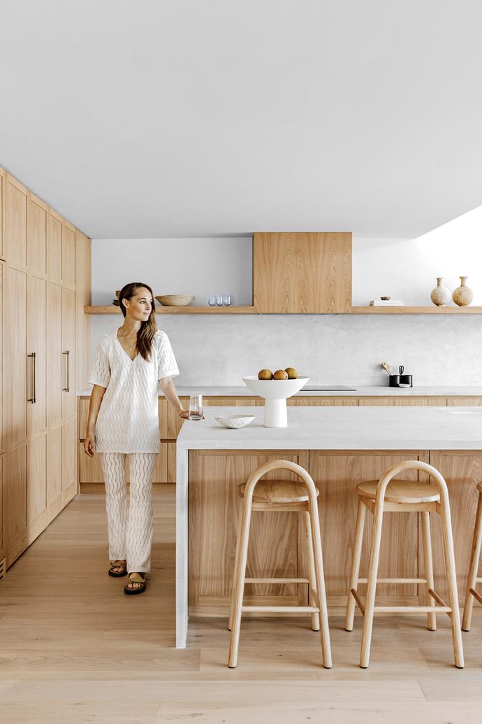 "If you wrote down the materials on paper — timber and concrete — it might sound quite boring, but I think it is calming because there are only a few elements," says Kate. The open shelf incorporates the enclosed exhaust, creating a seamless look. Concrete benchtops and splashback by [Set In Steel](https://www.setinsteel.com.au/|target="_blank"|rel="nofollow"). Handles, [Lo & Co Interiors](https://loandcointeriors.com.au/|target="_blank"|rel="nofollow"). Bobby stools, [Design By Them](https://www.designbythem.com/|target="_blank"|rel="nofollow").